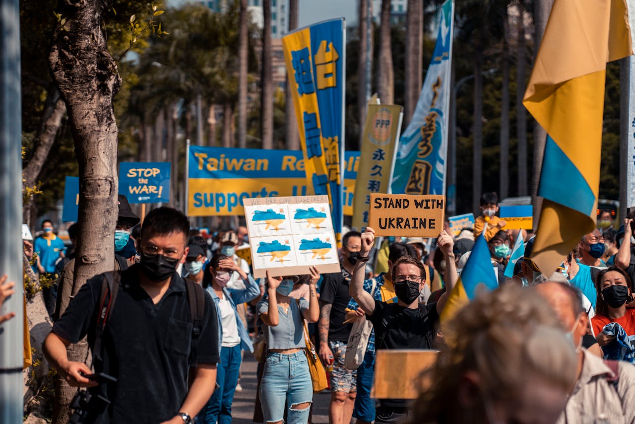 Outdoor protest supporting Ukraine with flags and placards in Taiwan.